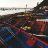 View of fishing boats on the beach, highlighting nets used in Smart Ocean chairs