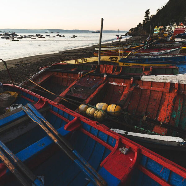 View of fishing boats on the beach, highlighting nets used in Smart Ocean chairs
