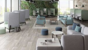 hag capisco and puls chairs in seagreen in open office environment with large windows